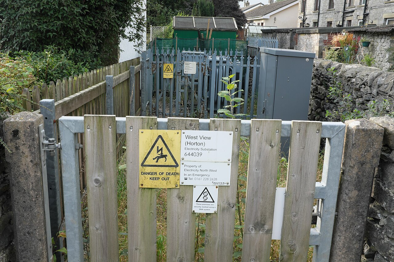 Fenced electricity substation among buildings in Horton in Ribblesdale
